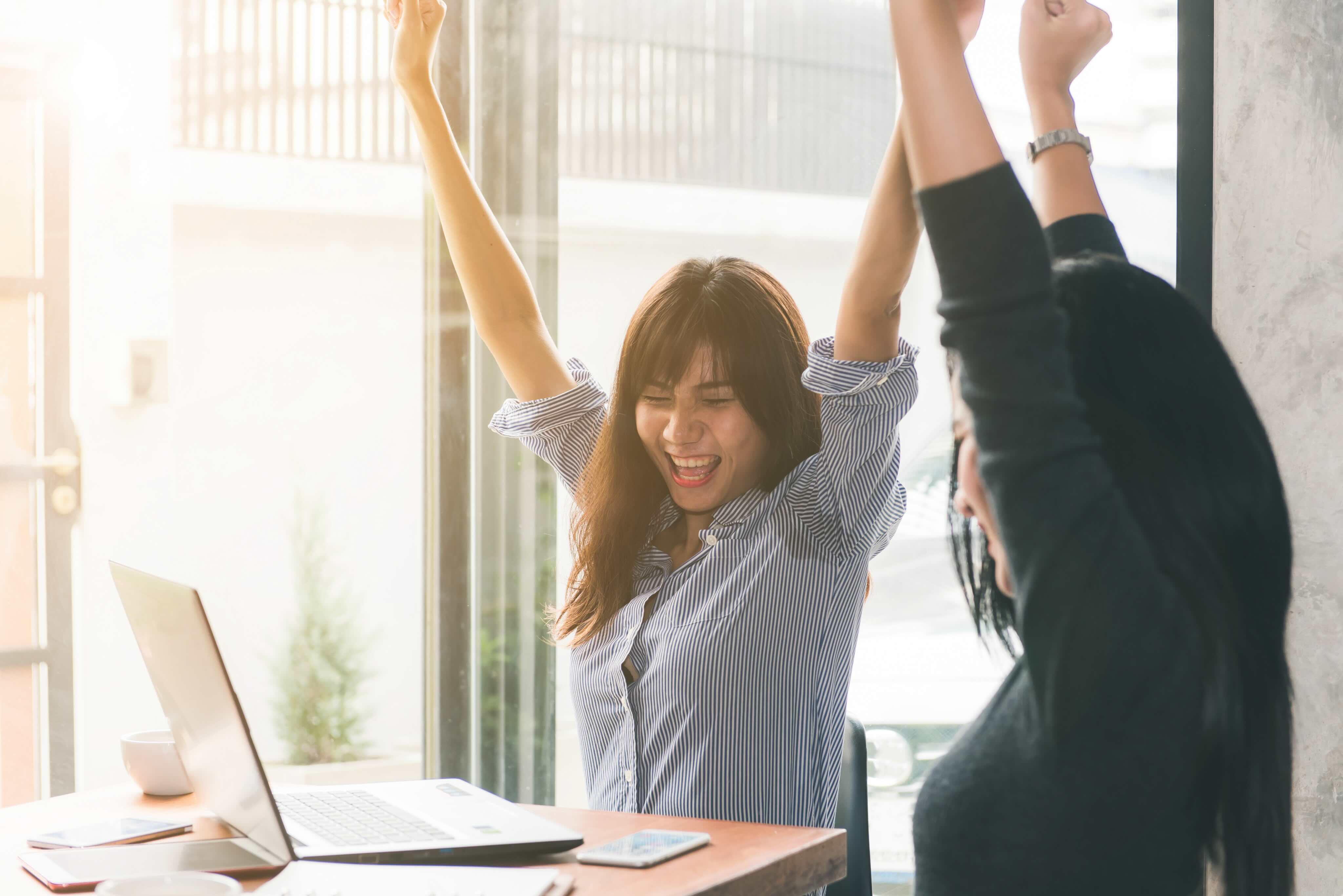 Happy workers celebrating success